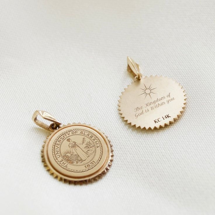 Inspired by vintage coin necklaces, the Sunburst Crest Necklace can be worn layered or alone as a chic statement. Pendant size: 15mm x 15mm x 1.2mm Bail Size: 3mm x 6.6mm Available in Sterling Silver, Cavan Gold, and 14K Gold 14k Gold Coin Jewelry Stamped 14k, 14k Gold Coin Jewelry For Commemoration, Brass Medallion Jewelry For Commemoration, Yellow Gold Charms Medallion Necklace, Engraved Gold Plated Medallion Necklace, 14k Gold Medallion Jewelry With Charms, 14k Stamped Medallion Coin Necklace As Gift, Commemorative Coin Pendant Medallion Jewelry, Engraved 14k Gold Medallion Necklace