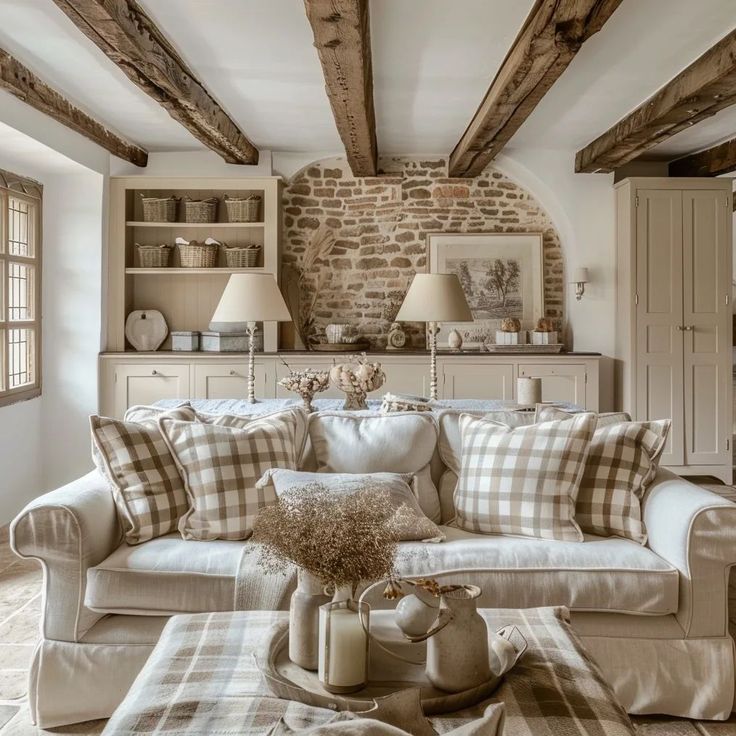 a living room filled with furniture and pillows