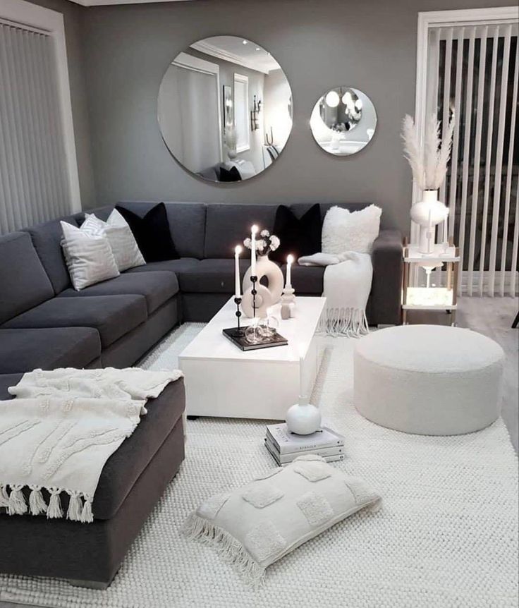 a living room filled with furniture and mirrors