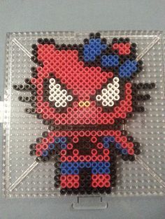 the pixel art is made out of legos and plastic beads, which are red, white, and blue