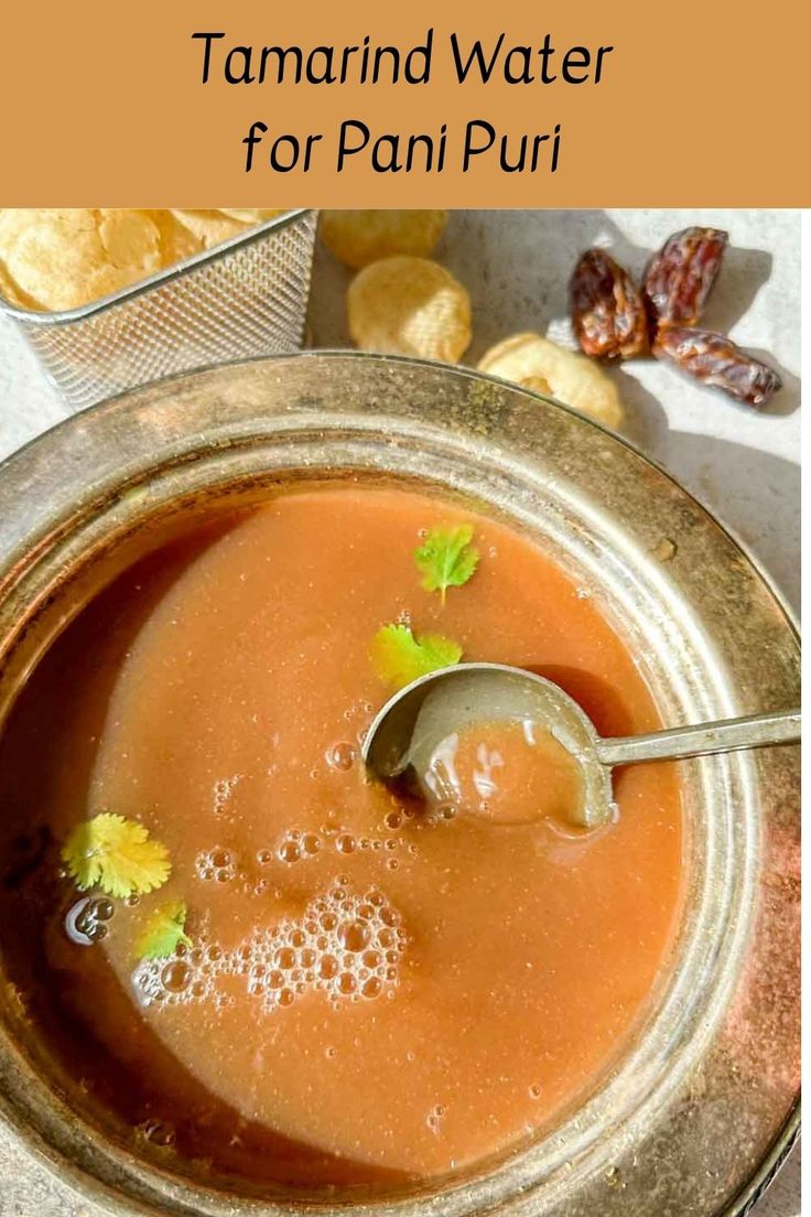 there is a bowl of soup with spoons in it and the words tamarin water for pani puri