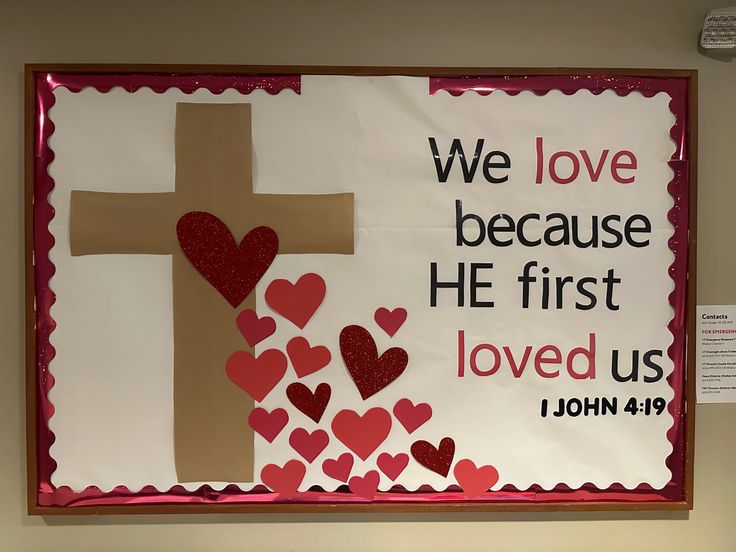 Brown paper cross, some sparkly red and some red construction paper hearts coming from the center of the cross and spilling to the bottom of the bulletin board. Text is “We love because he first loved us. 1 John 4:19”. John 15:9-17 Craft For Kids, Valentines Projects For Kindergarten, Christian Valentines Decor, Valentine Church Bulletin Board, February Church Bulletin Board Ideas, Kids Church Bulletin Boards, Children Church Decor Ideas, Valentine Bulletin Boards For Church, Church Valentine Bulletin Board Ideas