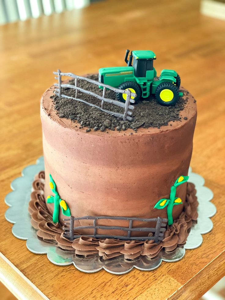 there is a cake that has been made to look like a farm tractor on it