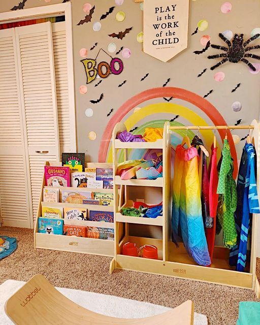 a child's playroom with toys and books