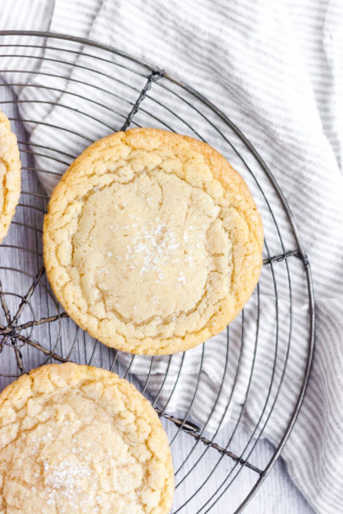 three cookies sitting on top of a wire rack