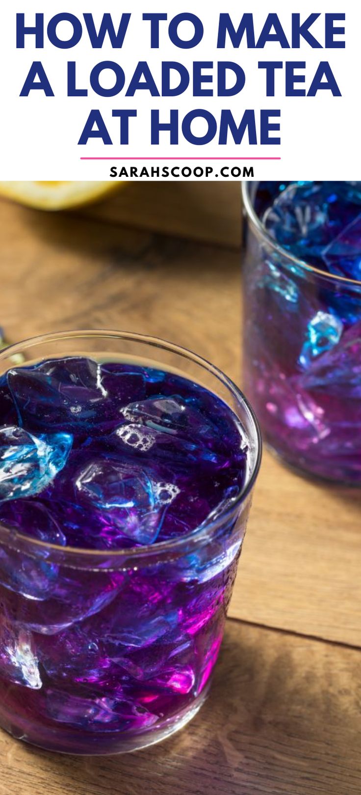 two glasses filled with liquid sitting on top of a wooden table