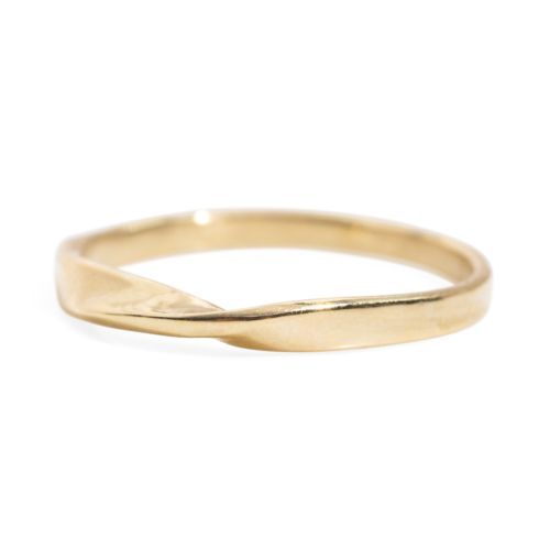 a gold ring with a curved band