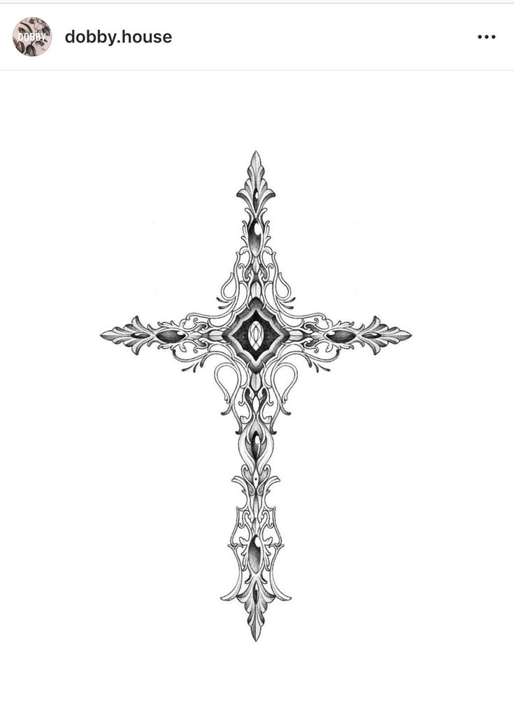 a black and white drawing of a cross with an intricate design on the center piece