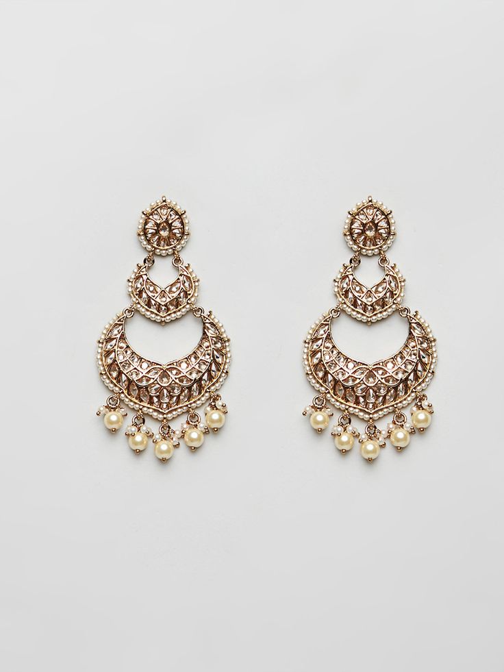 Beautiful Kundan earrings with stones and pearls Traditional Indian Jewelry: Slight Color variations are possible due to lighting and photography. If you are interested in purchasing this item and have any additional questions about this item, please feel free to email us at nazranaanj@gmail.com. For faster responses, call us at 732-283-1808 or WhatsApp us at 609-852-9922 Care instructionsKeep Jewelry away from direct heat, water, perfumes, deodorants and other strong -- chemicals as they may re Elegant Kundan Chandelier Earrings With Pearl Drop, Elegant Jeweled Chandbali Pearl Earrings, Elegant Stone Work Dangle Chandelier Earrings, Pearl Chandbali Earrings With Latkans, Elegant Chandelier Earrings With Stone Work, Elegant Dangle Chandelier Earrings With Stone Work, Elegant Jeweled Pearl Earrings For Festive Occasions, Ornate Kundan Earrings With Stone Work, Elegant Chandbali Beaded Earrings For Festivals