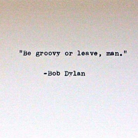 an old typewriter with the words be groovy or leave, man bob dylan