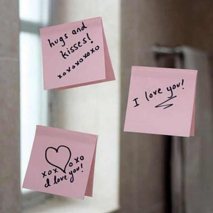 two sticky notes attached to a mirror with writing on them