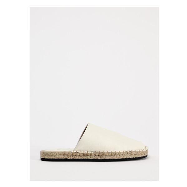 Leather espadrilles. Topstitching around welt. Sole height: 0.4 inches (1 cm) Classic Summer Slip-on Espadrilles, Leather Espadrilles With Textured Footbed, Classic Slip-on Espadrilles With Stitched Sole, Slip-on Espadrilles With Stitched Sole, Summer Slip-on Sandals With Contrast Sole, Classic Round Toe Espadrilles For Summer, Classic Espadrilles With Stitched Sole And Round Toe, Classic Summer Espadrilles With Stitched Sole, Flat Slip-on Espadrilles With Leather Sole