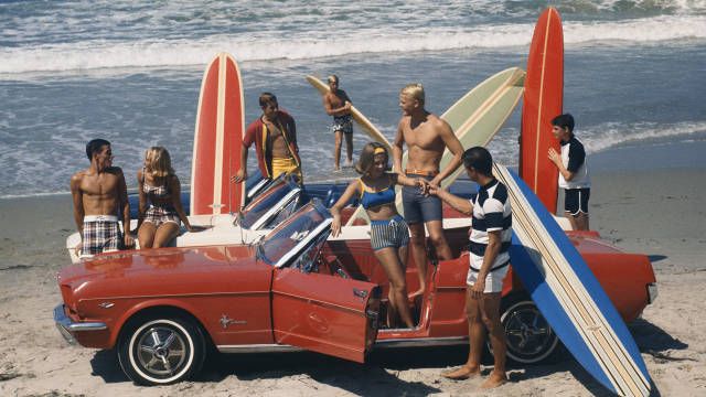 Fifty Years of the Ford Mustang An American Phenomenon - Road & Track 50s Surfer Aesthetic, Vintage Surfing Photos, 1980s Beach Aesthetic, 1970s Beach Aesthetic, 1960s Beach Aesthetic, California Surf Aesthetic, 70s Surf Aesthetic, Vintage Surf Aesthetic, Vintage Beach Aesthetic