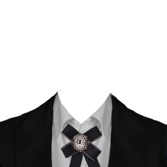 a man wearing a black and white tie with a bow on it's lapel