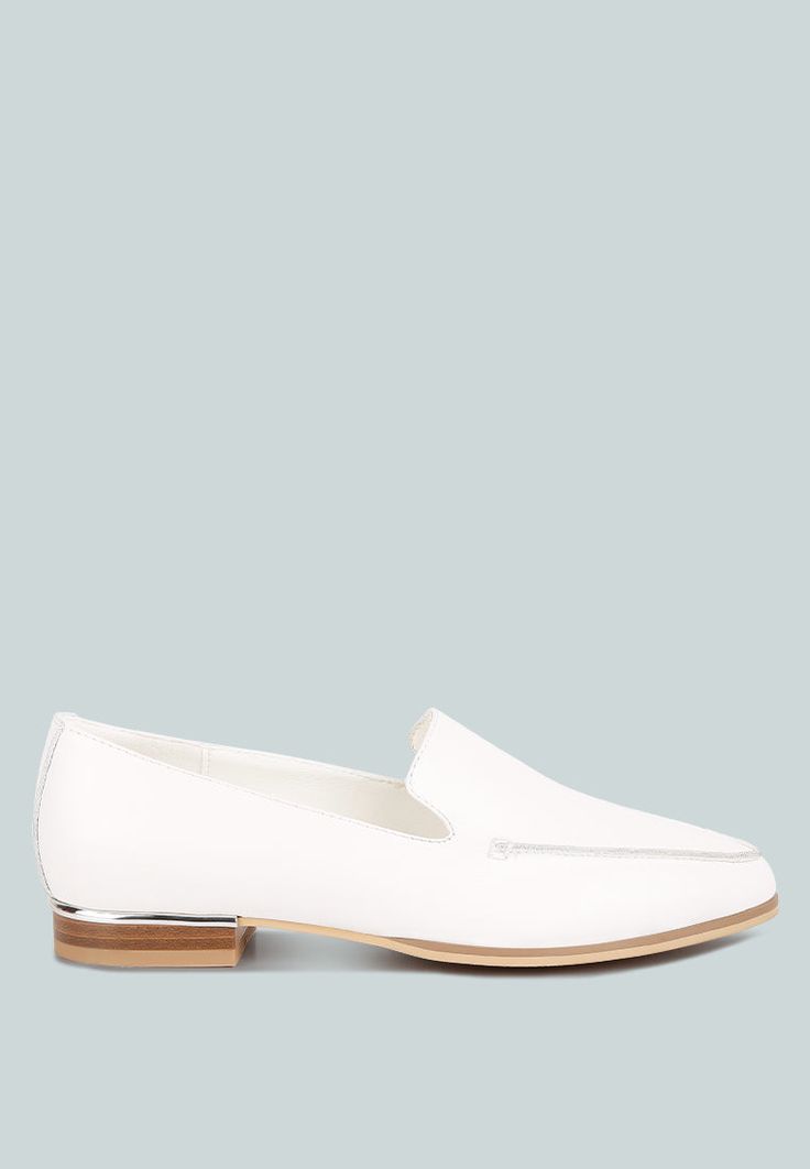 The minimalist loafers are a classic versatile style and ideal as office shoes that look elegant and chic. The metallic sling adds a bling feature that looks luxe. The loafers are comfortable to wear with soft cushion insoles. Upper Material: Genuine Leather Outer sole: Rubber Closed Pointed Toe Metallic Sling Detail Lightly Cushioned Insole Flat Heels RCSH4053 Chic White Slip-ons For Office, Modern White Slip-ons For Work, Sleek Formal Loafers For Spring, Sleek Formal Spring Loafers, Sleek Formal Loafers, Sleek Spring Loafers For Office, Modern Formal Flats For Spring, Sleek Office Loafers For Spring, Modern Spring Formal Flats