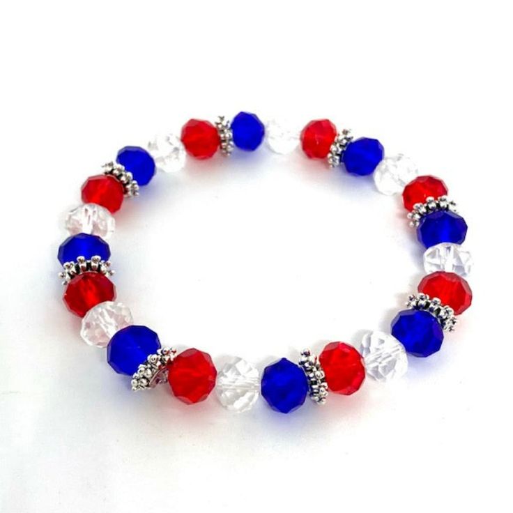 Celebrate July 4th with backyard BBQ's, fireworks and cool jewelry! This red, white and blue patriotic bracelet is made with briolette beads, Tibetan silver spacer beads and stretch cord, so one size fits all! Show off your red, white and blue this summer! Patriotic Bracelet, Cool Jewelry, Heart Jewelry, July 4th, Red White And Blue, Spacer Beads, Stretch Bracelets, Fireworks, One Size Fits All