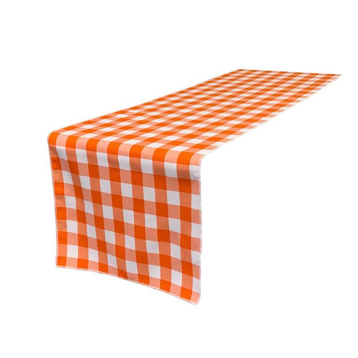 an orange and white checkered tablecloth on a white background with room for text