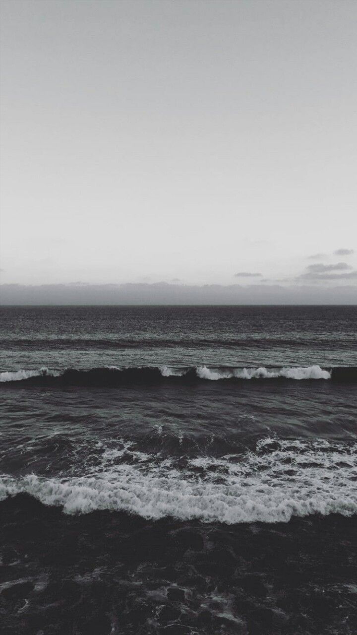 a black and white photo of the ocean