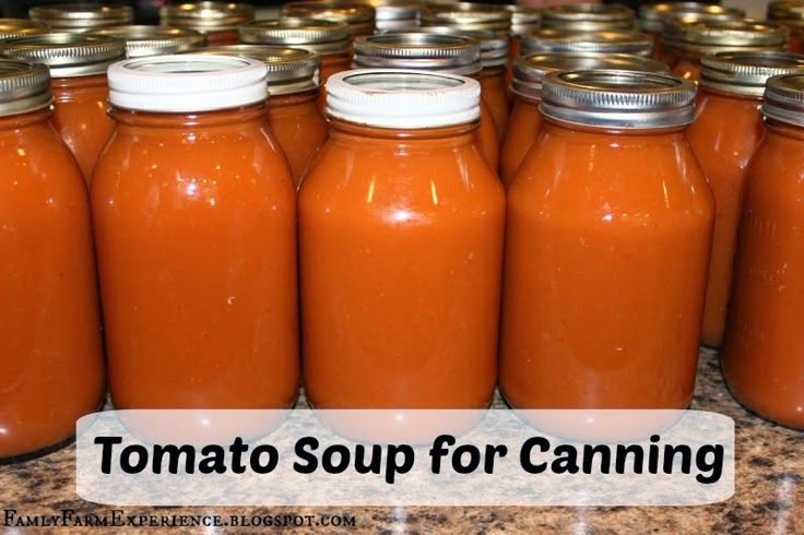 many jars of tomato soup are lined up on a counter top with the words tomato soup for canning