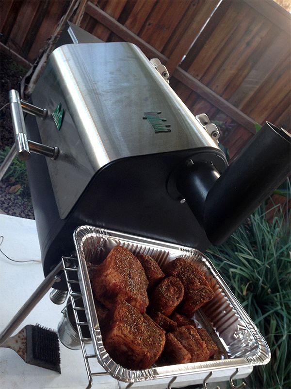 some food is being cooked on an outdoor grill