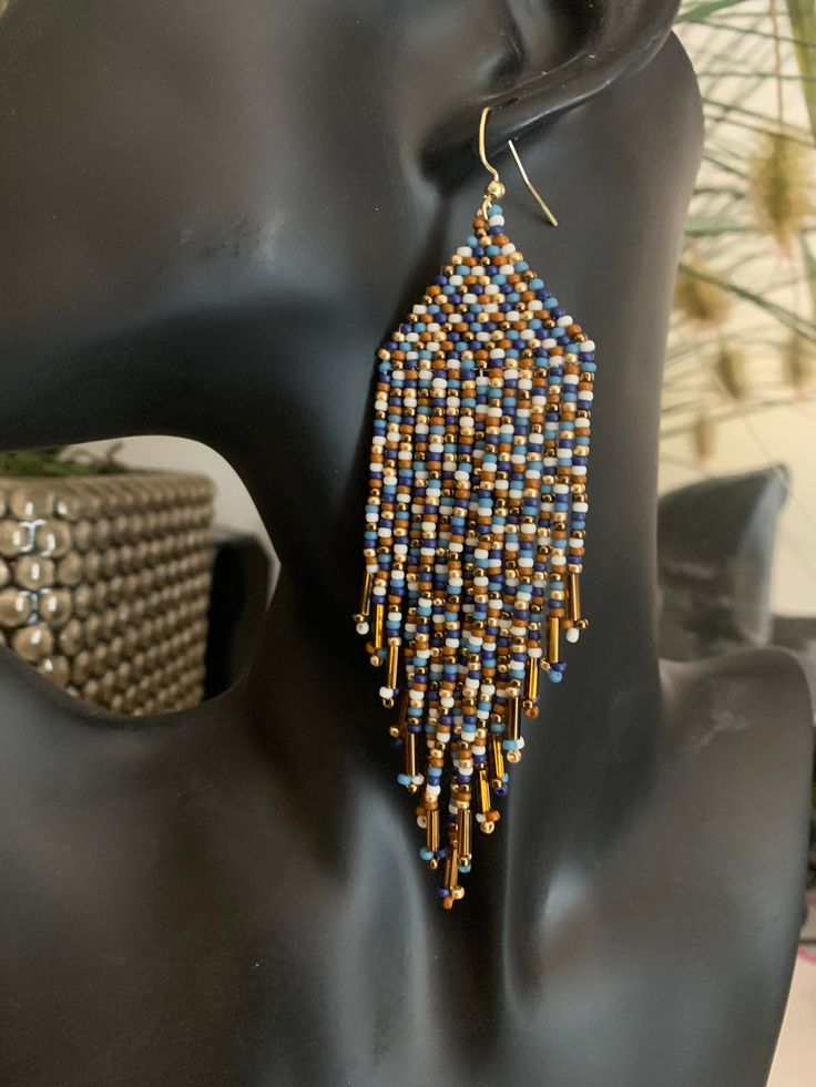 Beaded Fringe Earrings. Multi coloured in shades of blue, bronze, off white, brown and gold. Elegant Beaded Earrings With Colorful Beads, Multicolor Dangle Beaded Earrings With Gold Beads, Elegant Brown Beaded Earrings With Colorful Beads, Artisan Multicolor Beaded Earrings With Gold Beads, Bohemian Brown Beaded Earrings With Gold Beads, Multicolor Round Beads Earrings With Gold Beads, Brown Dangle Beaded Earrings With Large Beads, Beaded Copper Earrings, Gold Drop Earrings With Large Beads