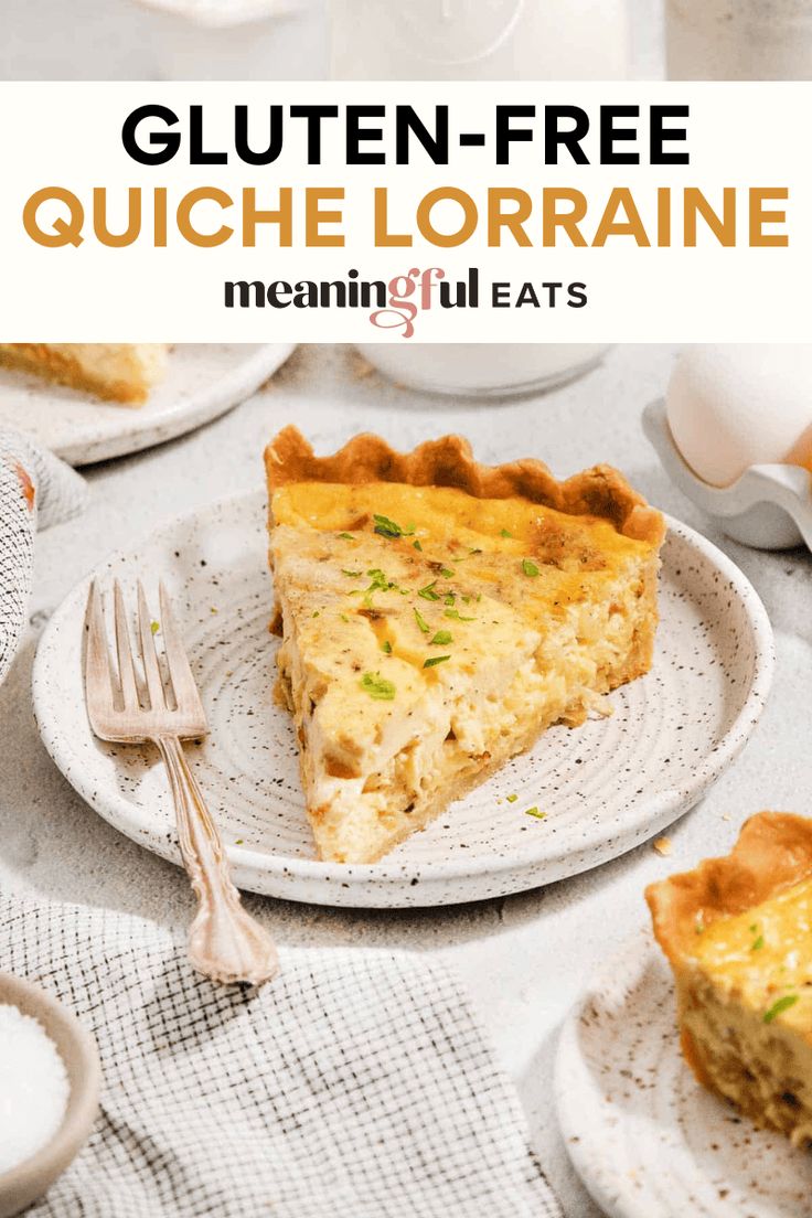 a slice of quiche lorainne on a plate with a fork and spoon