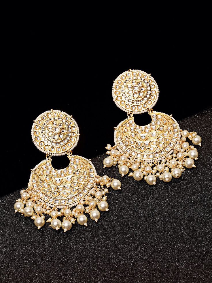 These exquisite gold-toned 2-layer crescent-shaped chandbali earrings come with kundan stone studs & beads, are gold-plated, and are secured with a post and back closure. These handcrafted chandbalis can be styled with any ethnic outfit for a dramatic impact, or an evening outfit to complete a dazzling look. Eitherway, complements are all yours! Product color may vary based on the monitor or screen you are using.See FAQ for more details. Size Length: 11 cm Details Material: BrassStones: Kundan & Luxury Bridal Chandbali Earrings With Tilla, Luxury Chandbali Earrings With Cutdana, Luxury Chandbali Cutdana Earrings, Festive Gold Hoop Earrings With Pearl Drop, Gold Hoop Earrings With Pearl Drop For Festivals, Festival Chandbali Hoop Earrings With Pearl Drop, Chandbali Chandelier Earrings With Intricate Design For Reception, Chandbali Pearl Drop Earrings, Gold-plated Chandbali Danglers With Pearl Drop