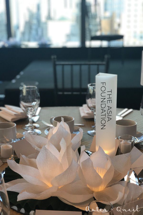 a table set for an event with place settings