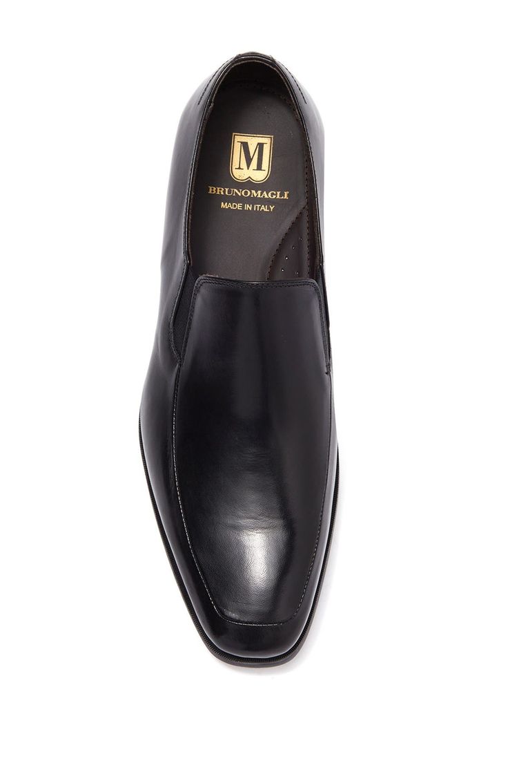 Buttery leather composes this slip-on pair of loafer dress shoes. Sizing: true to size. Moc toe. Slip-on style. Leather construction. Made in Italy Business Casual Slip-ons With Almond Toe And Stitched Sole, Business Casual Slip-ons With Leather Sole And Almond Toe, Business Almond Toe Slip-ons With Leather Lining, Business Leather Slip-on Shoes With Rubber Sole, Slip-on Moc Toe Loafers For Office, Business Casual Closed Toe Slip-ons With Leather Sole, Business Slip-on Moccasins With Branded Insole, Slip-on Oxfords With Stitched Sole And Plain Toe, Classic Slip-on Closed Toe Dress Shoes