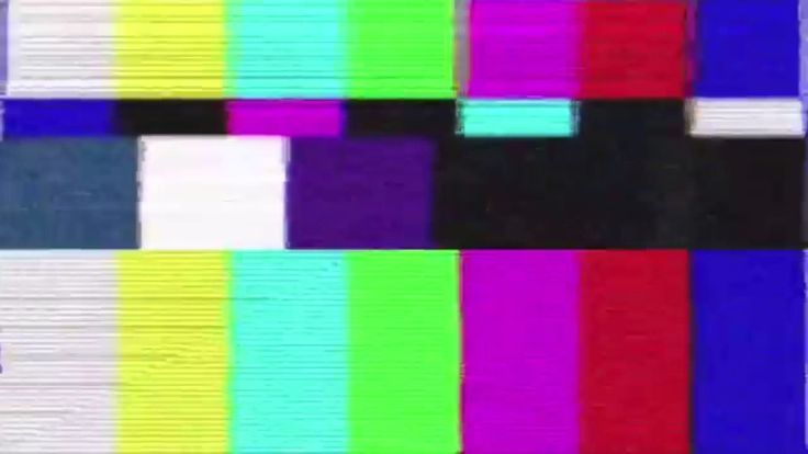 the television screen is multicolored and has no image on it, but there are several squares in each color