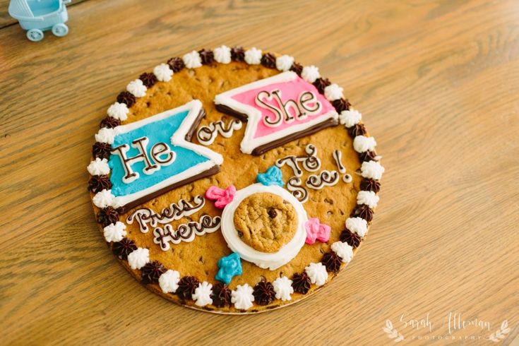 there is a cookie decorated with the words she or she