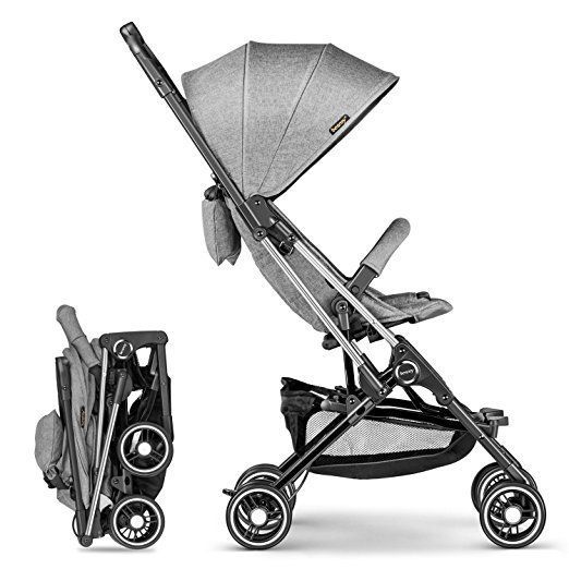 a baby stroller with the seat up and wheels down, next to it's side