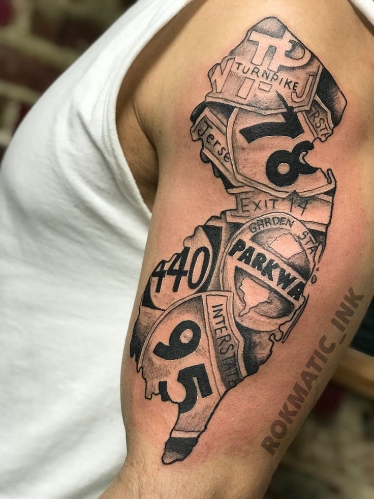 a man with a tattoo on his arm that has the number forty and two different numbers