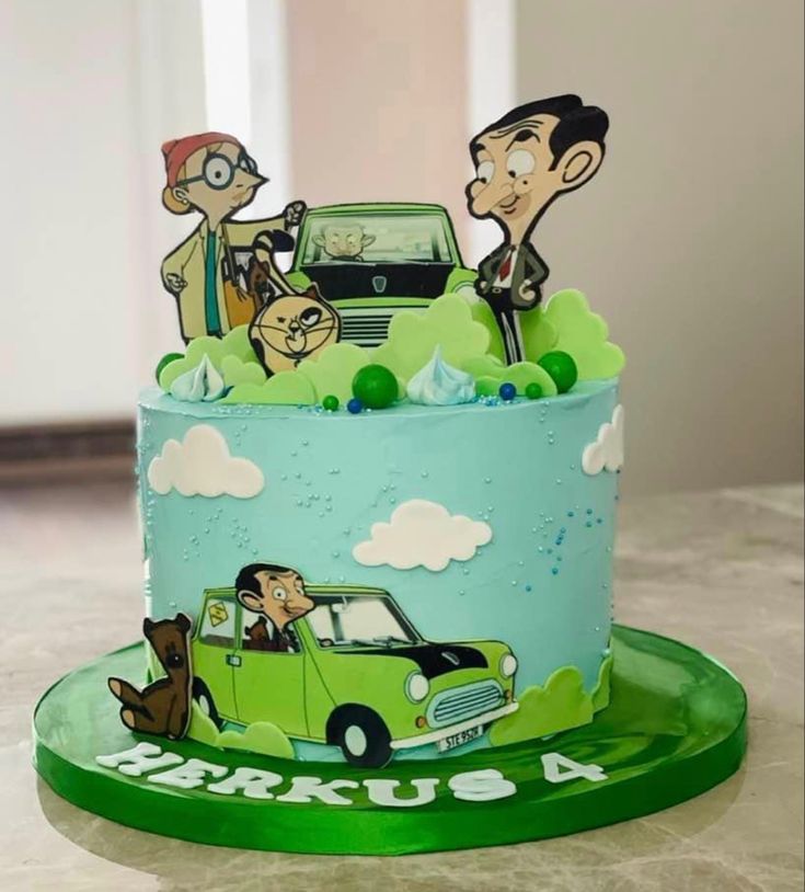 a cake with cartoon characters on it sitting on a table