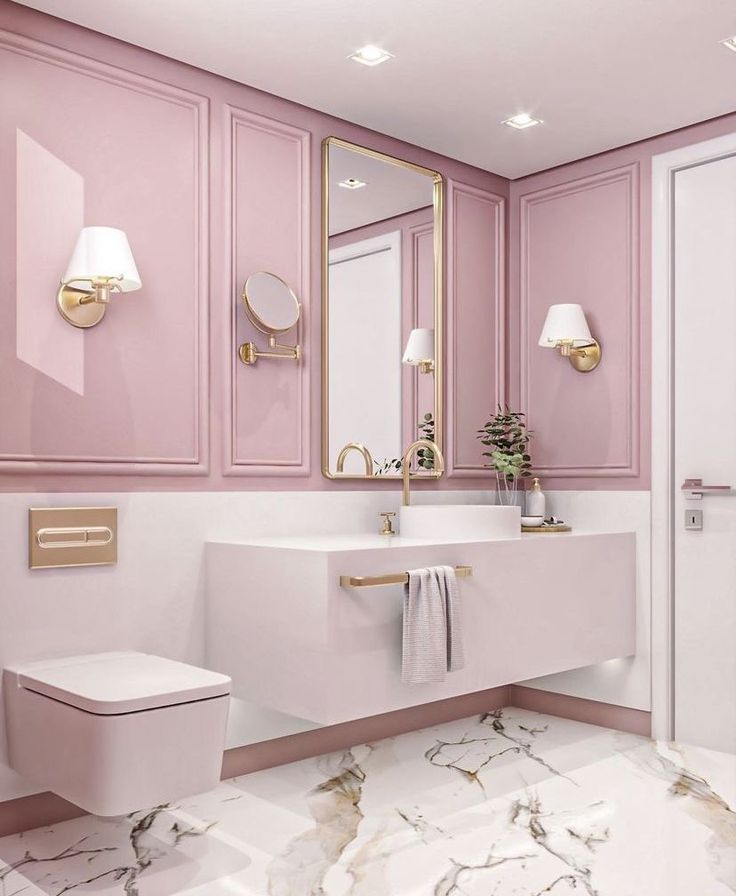 a bathroom with pink walls and marble flooring