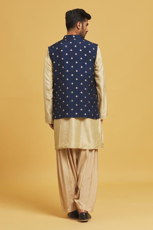 Navy blue silk nehru jacket with floral motifs applique embroidery.
Components: 1
Pattern: Applique embroidered
Type Of Work: Floral motifs
Neckline: Mandarin collar
Sleeve Type: Sleeveless
Fabric: Silk
Color: Blue
Other Details: 
Closure: Front buttons
Note: Kurta and pant worn by the model are not for sale.
Occasion: Sangeet - Aza Fashions Nehru Jacket For Men, Nehru Jacket, Nehru Jackets, Applique Embroidery, Kurta With Pants, Jacket For Men, Fabric Silk, Blue Silk, Floral Motifs