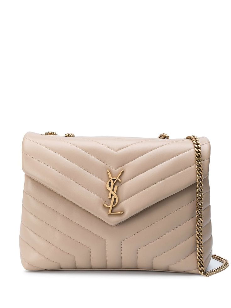 Saint Laurent shoulder bag in chevron-quilted leather. Chain and leather shoulder straps. Flap top with snap closure. Exterior, metallic YSL logo medallion. Interior, zip pocket. Made in Italy. Mochila Chanel, Sac Yves Saint Laurent, Pochette Louis Vuitton, Lou Lou, Luxury Purses, Saint Laurent Bag, Van Cleef Arpels, Womens Purses, Quilted Leather