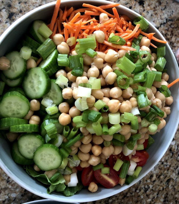 a bowl filled with vegetables and chickpeas