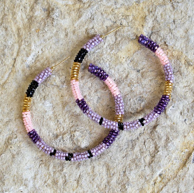 Hand-Beaded Hoop Earrings - Multi-Mauve Dare to dazzle in these well-beaded drops, which add a subtle shine that elevates your most casual look. Plated metal, cotton thread, glass beads Origin: India Dimensions: 2.5" diameter Olivia Dar, a French designer based in India, takes a contemporary spin on traditional Indian accessories. All the pieces are handmade by artisans in her studio in Delhi as well as ethically sourced from artisans in several regions of India and Central Asia (Afghanistan, Pa Indian Accessories, Beaded Earrings Diy, Silver Elephants, Earrings Diy, Beading Ideas, Diy Wire Jewelry, Native American Beading, French Designer, Beaded Jewelry Patterns