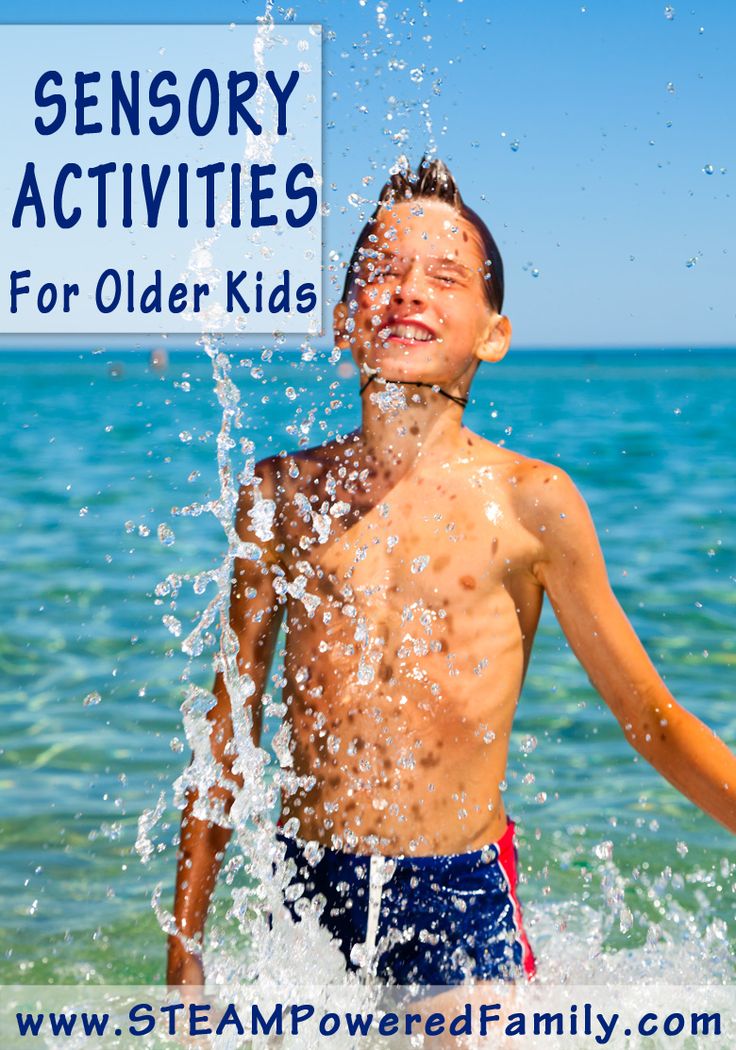 a boy splashing water on his face with the words sensory activities for the older child