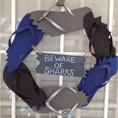 there is a sign that says beware of sharks on the front of a door