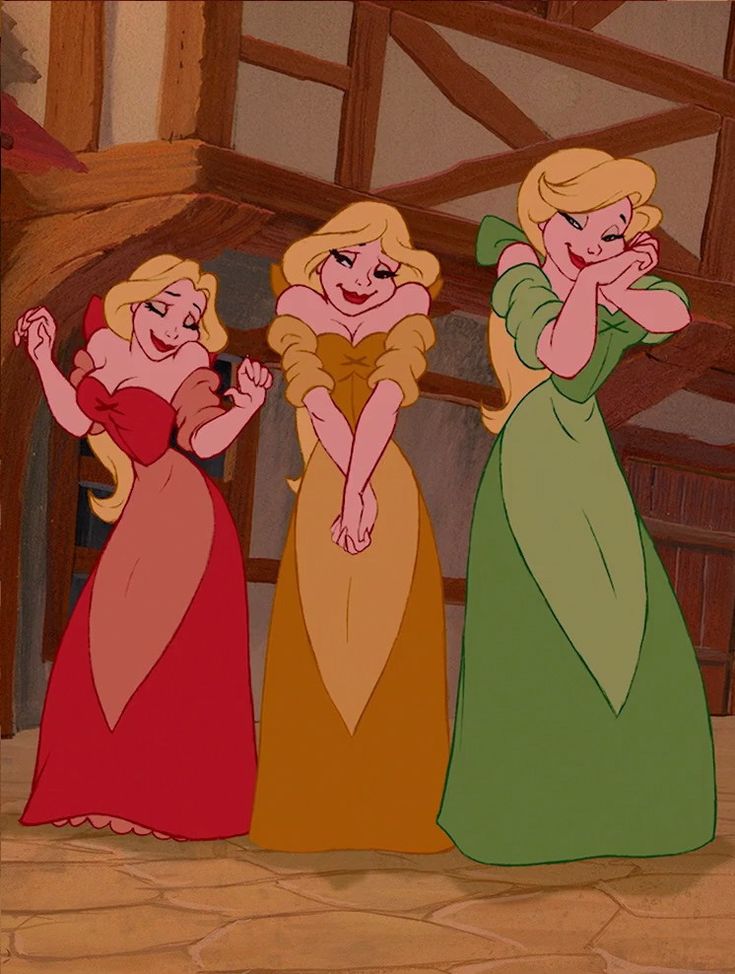 three women in dresses standing next to each other