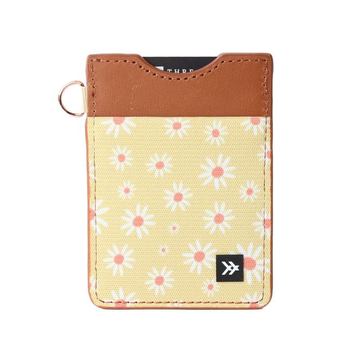 a card case with a flower pattern on the front and brown leather strap, sitting on top of a white background