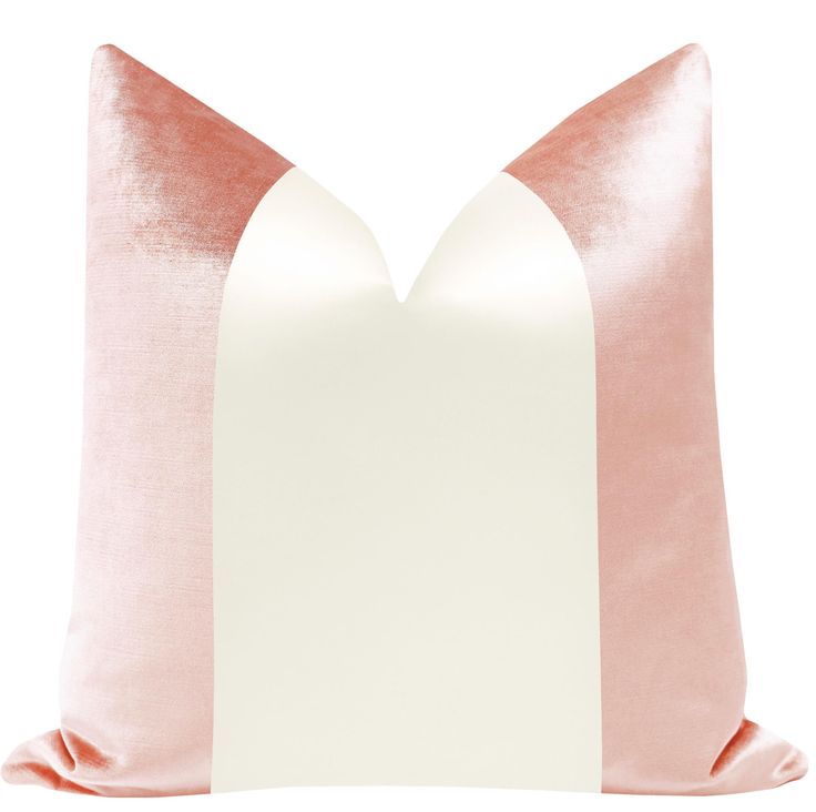 a pink and white pillow on a white background