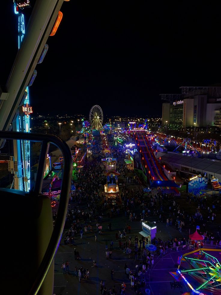 an aerial view of a carnival at night