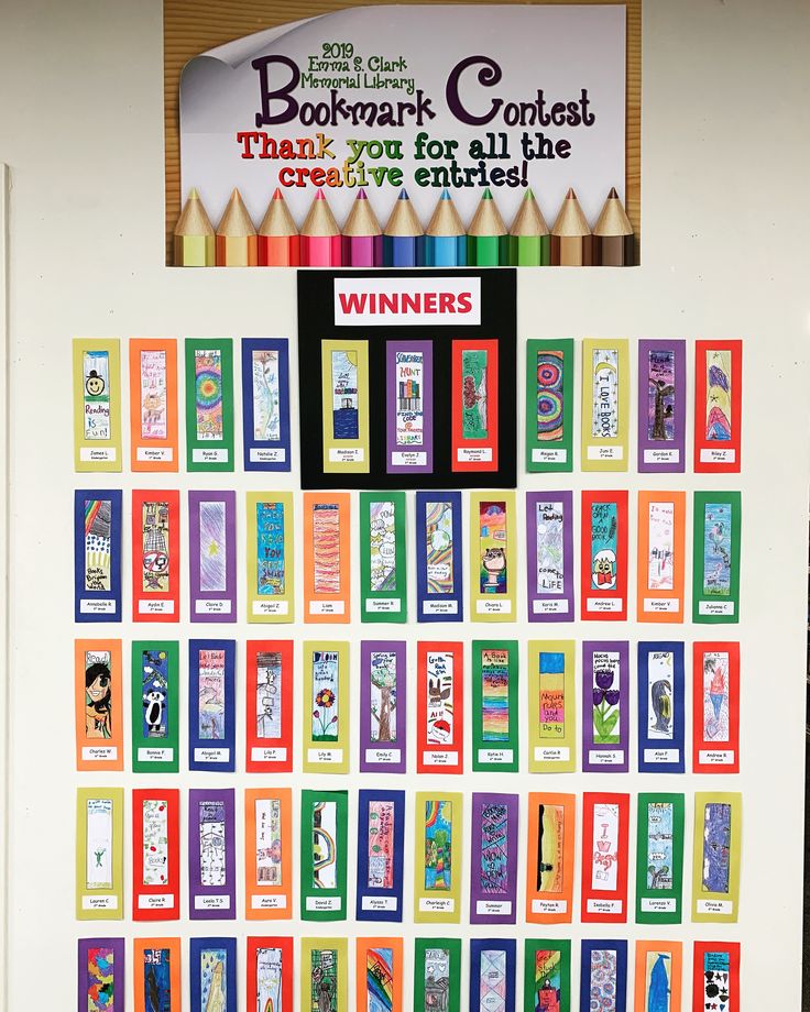 a bulletin board that has been decorated with pictures and words on it, along with a winner's ribbon