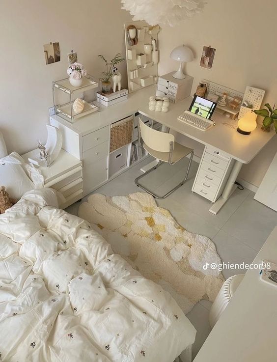 a bedroom with a bed and desk in it