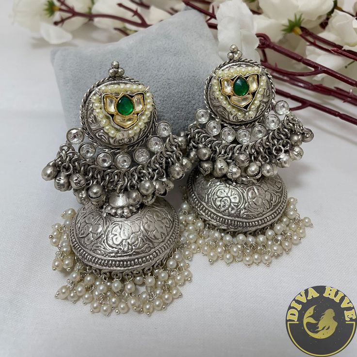 Diva Exclusive Statement Earring in Brass plating with silver coated Metal : Brass with 92.5 Silver Polished Nickel Free Handcrafted Perfect for all occasion(Party, Wedding ,Engagement) Free US standard shipping Ready to ship from New Jersey , United States Highest quality and craftsmanship CARE Store them in moisture free areas and keep them away from water and liquid fragrances Oxidised Jhumka, Jewellery Earrings, Statement Earring, Silver Coat, Green Diamond, Fancy Jewelry, Fashion Jewelry Earrings, Engagement Jewelry, Fashion Jewellery