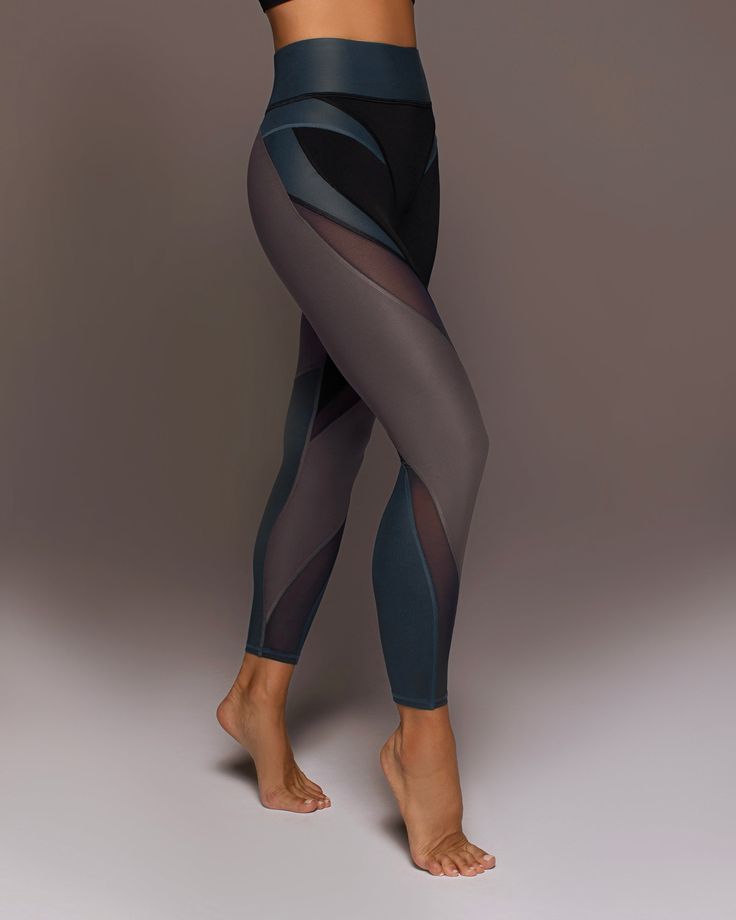 Designer's Notes Our hero legging. Color-blocking panels and sculpting mesh inserts join forces, becoming a legging you've never seen before. Crafted in Liquid Gloss fabric, for a sophisticated metallic shine. Features Sweat wicking Eight-way stretch 3" Shaperband functions as shapewear to taper the waistline and offer support and flexibility while staying light and soft Mesh inserts on thigh & lower leg Gusset designed for comfortable movement Made with Love in Canada Size & Fit High waisted Sl Compressive Mesh Leggings For Athleisure, Compression Mesh Leggings, Compression Nylon Leggings With Mesh Back, Compressive Leggings With Mesh Back For Pilates, Compressive Mesh Back Leggings For Pilates, Compressive Mesh Leggings For Workout, Compressive Mesh Workout Leggings, Compressive Mesh Yoga Tights, Edgy Workout Outfits