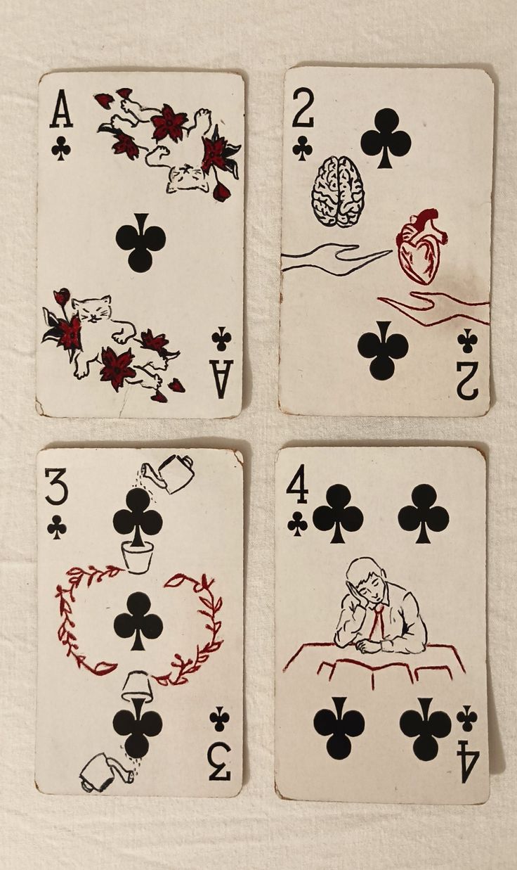 four playing cards with different designs on them